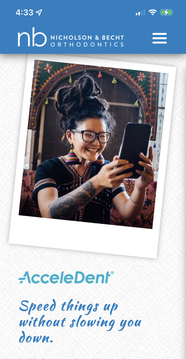 Screengrab of the mobile website with picture of a person smiling at a phone with text 'Speed things up without slowing you down'