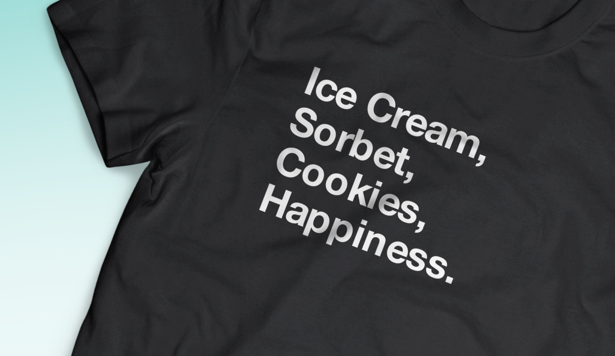 A black t-shirt with words 'Ice Cream, Sorbet, Cookies, Happiness'.