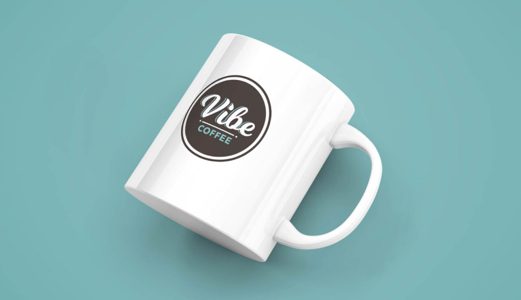 A mug with the Vibe coffee logo on it