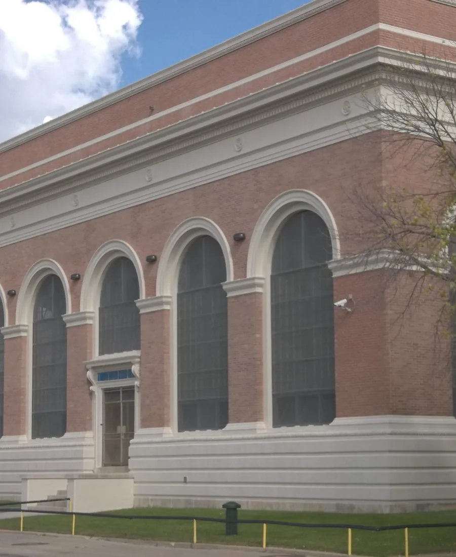 Chicago’s Central Park Pump Station, a red-brick building with tall arched windows and white stone trim.