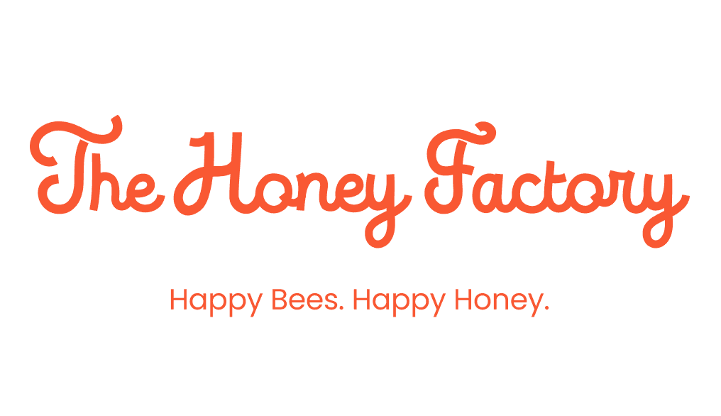 The Honey Factory wordmark logo in orange script typography with tagline Happy Bees. Happy Honey.