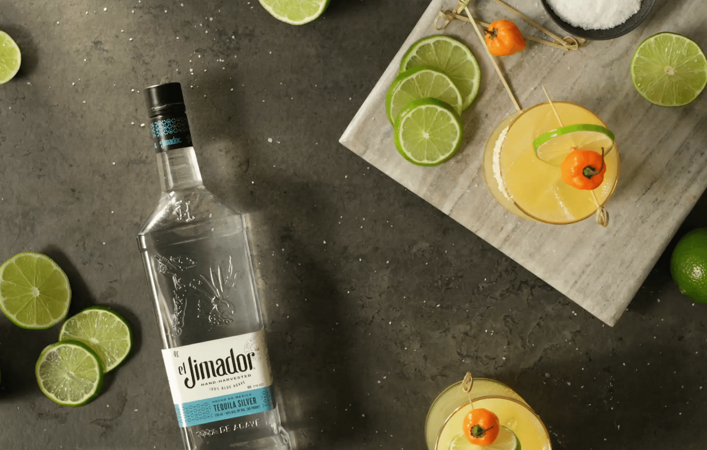 el Jimador Silver bottle with fresh lime garnishes and craft cocktails