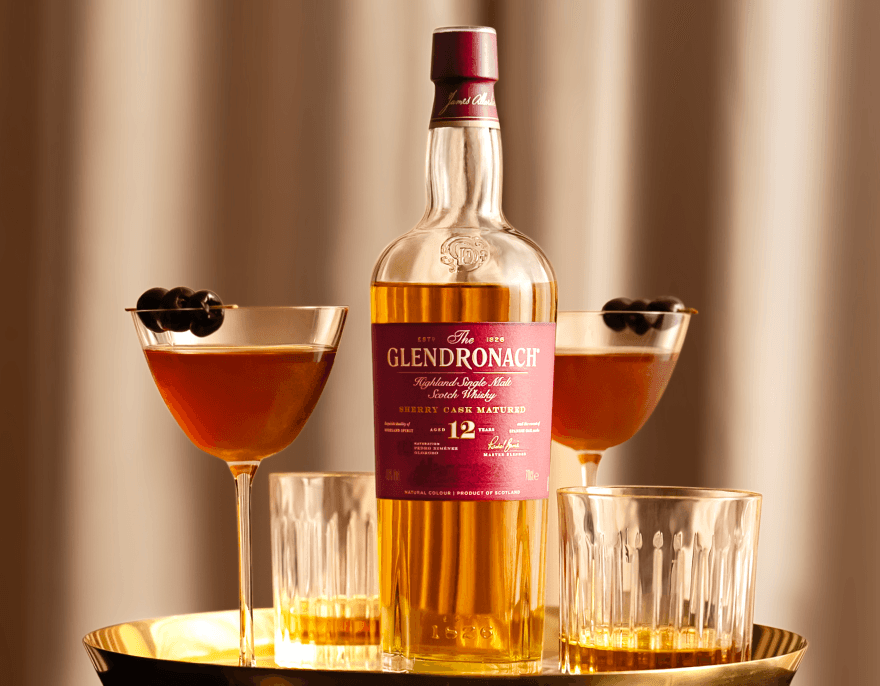 Cocktail presentation with two glasses and the 12 Year bottle