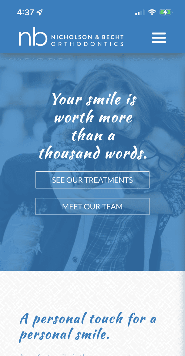 Mobile view of the homepage hero with ‘Your smile is worth more than a thousand words’ and call-to-action buttons