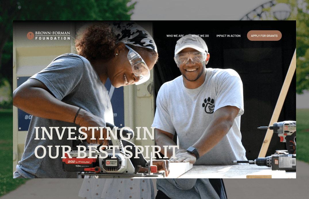 Homepage hero section featuring volunteers at work with headline Investing In Our Best Spirit
