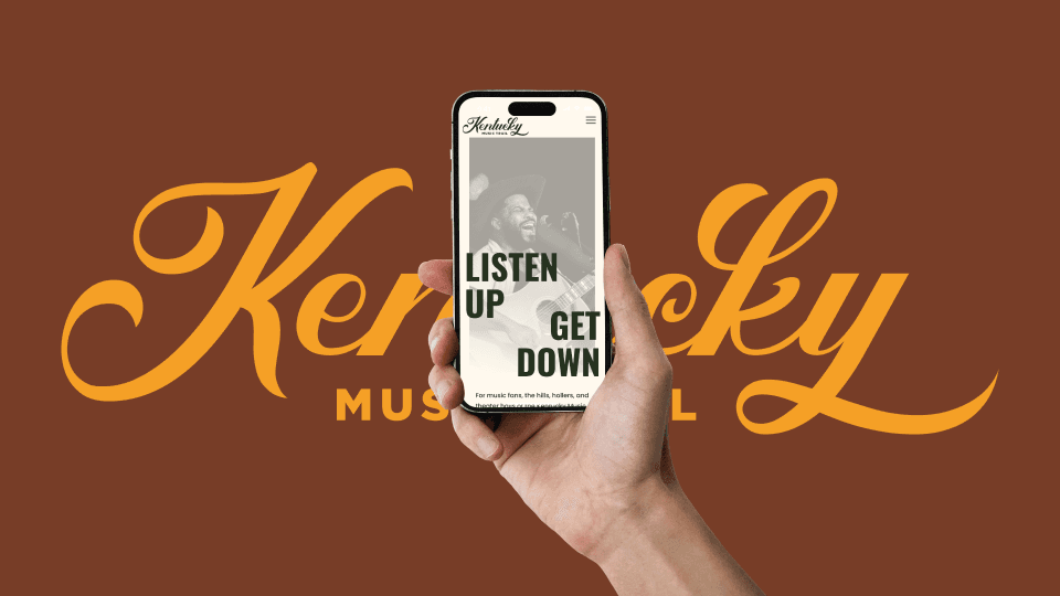 Hand holding smartphone displaying Kentucky Music Trail mobile website