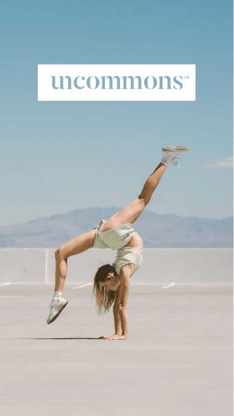 Mobile hero image of woman doing handstand in desert landscape with UnCommons logo overlay